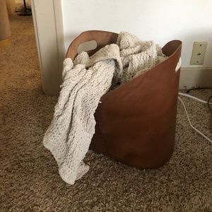 Studio McGee tan leather blanket storage